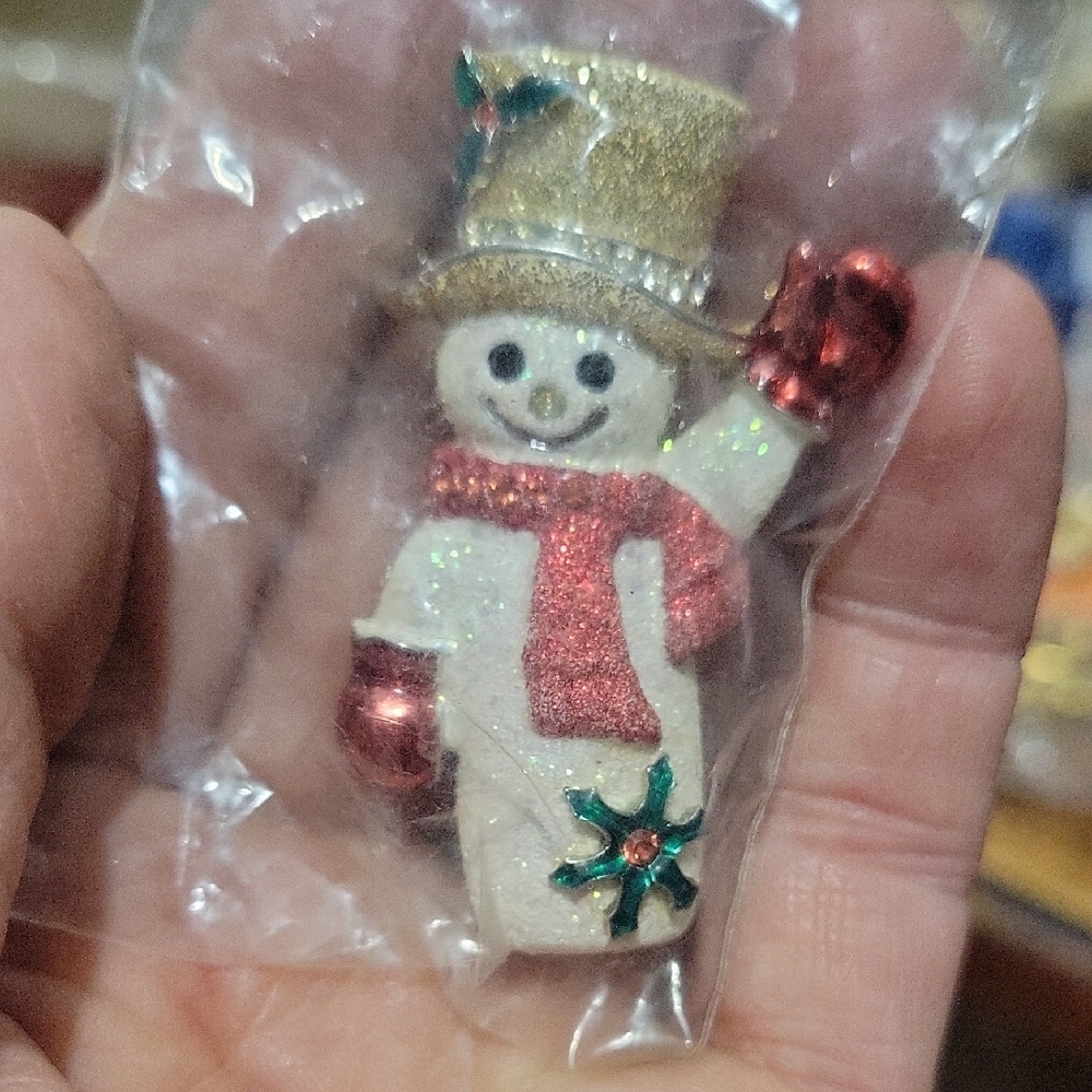 Festive Snowman Ornament with Red and Gold Accents
